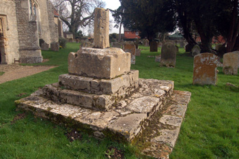 Medieval cross base in Oakley churchyard March 2011